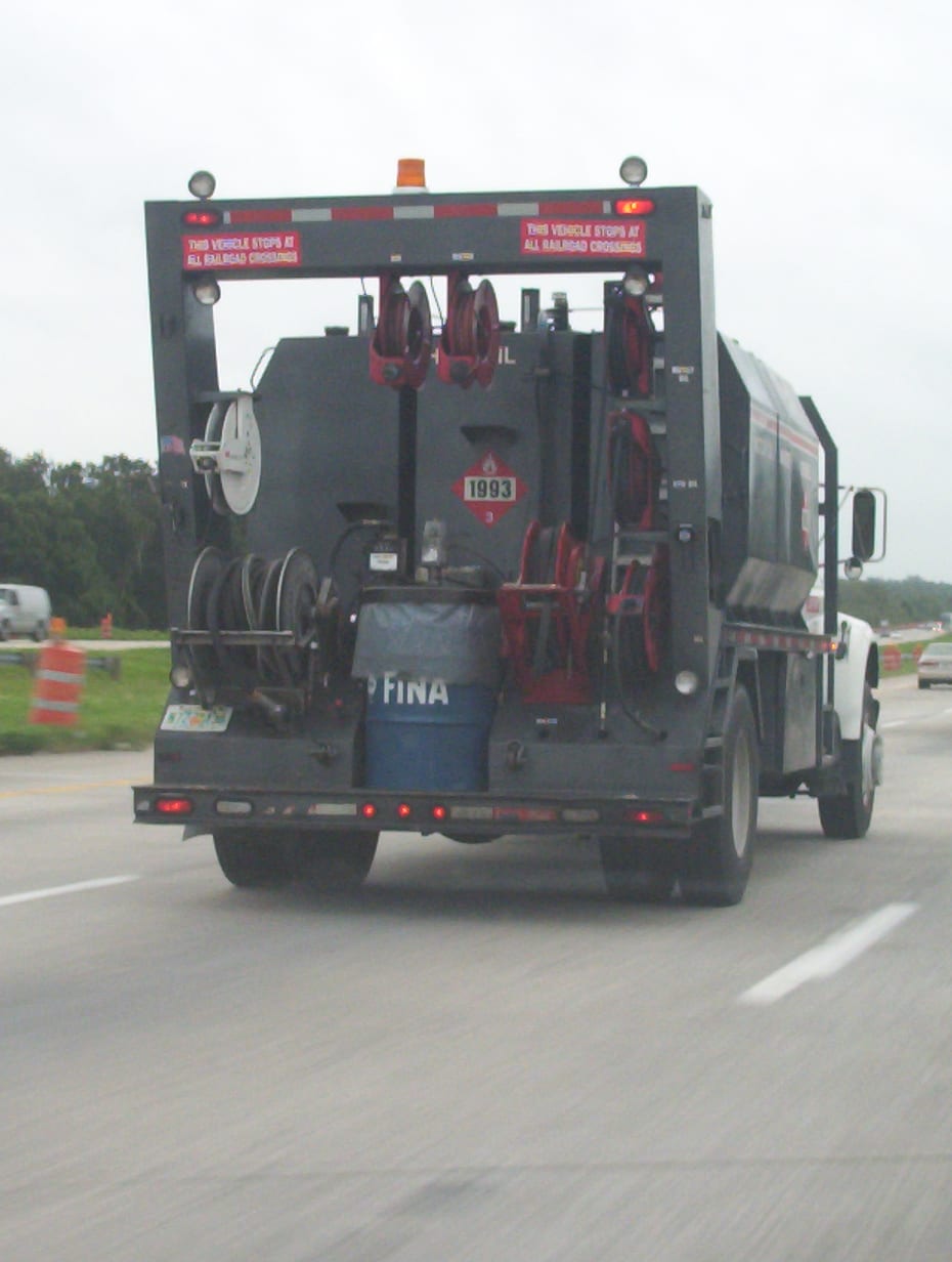 Rear of a fuel service truck carrying a diamond hazardous materials placard