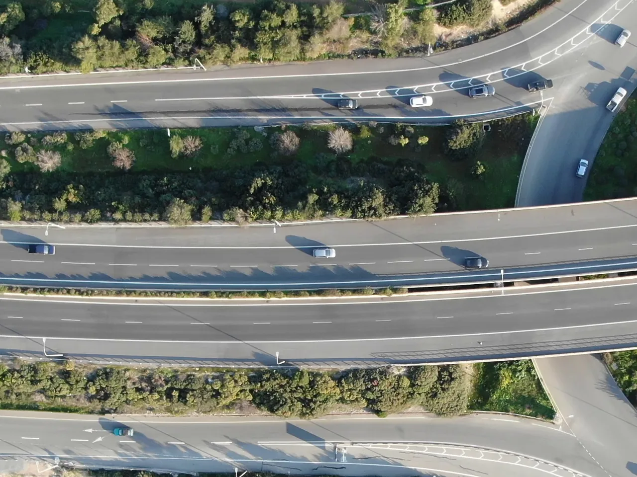 A drone photo of a road junction with queues of cars: a part of it with 11 vehicles, and the 24 boxes Claude Sonnet 5.5 at default settings returned there.