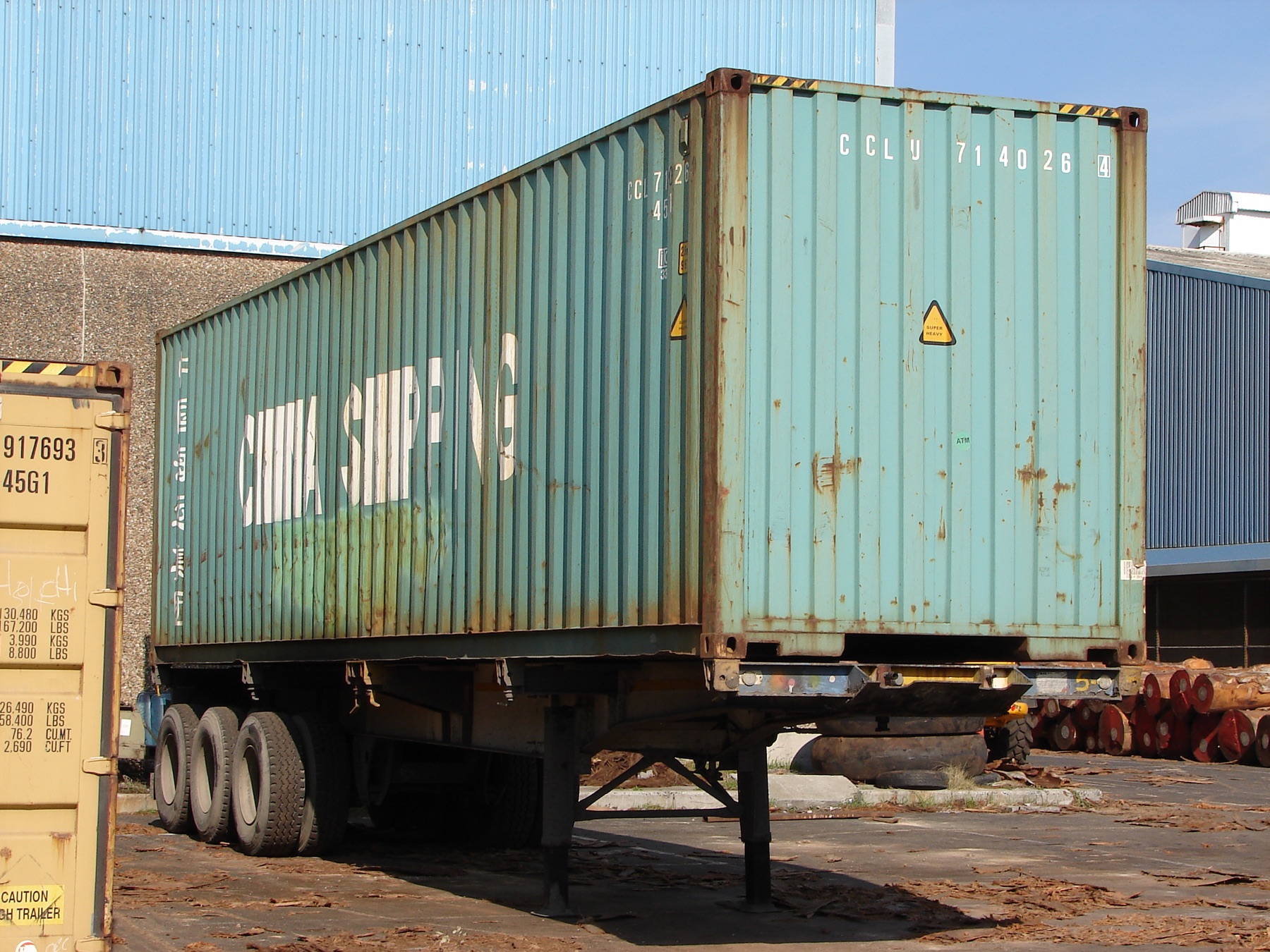 Weathered shipping container with an ISO identifier